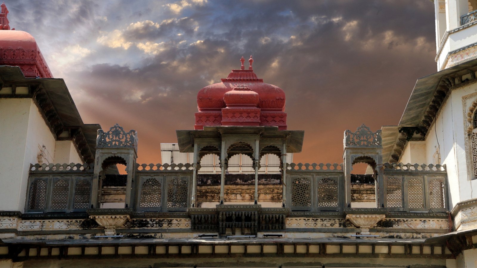 Gulab Bagh in Udaipur, a sprawling rose garden with colonial-era charm, shaded pathways, and a tranquil lotus pond nestled among heritage trees.
