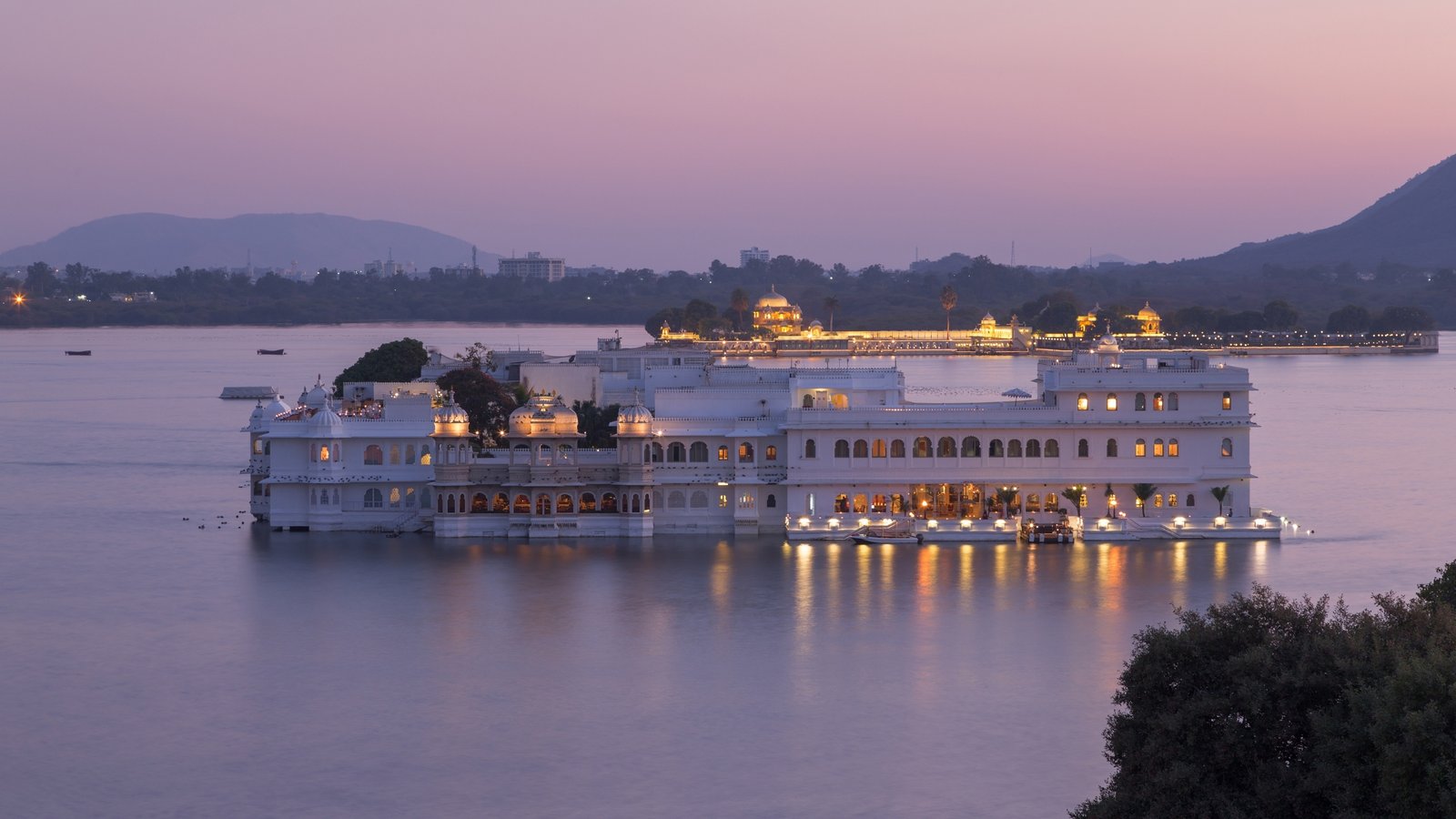Gulab Bagh in Udaipur, a historic rose garden with colonial charm, shaded walkways, and a tranquil lotus pond surrounded by heritage trees