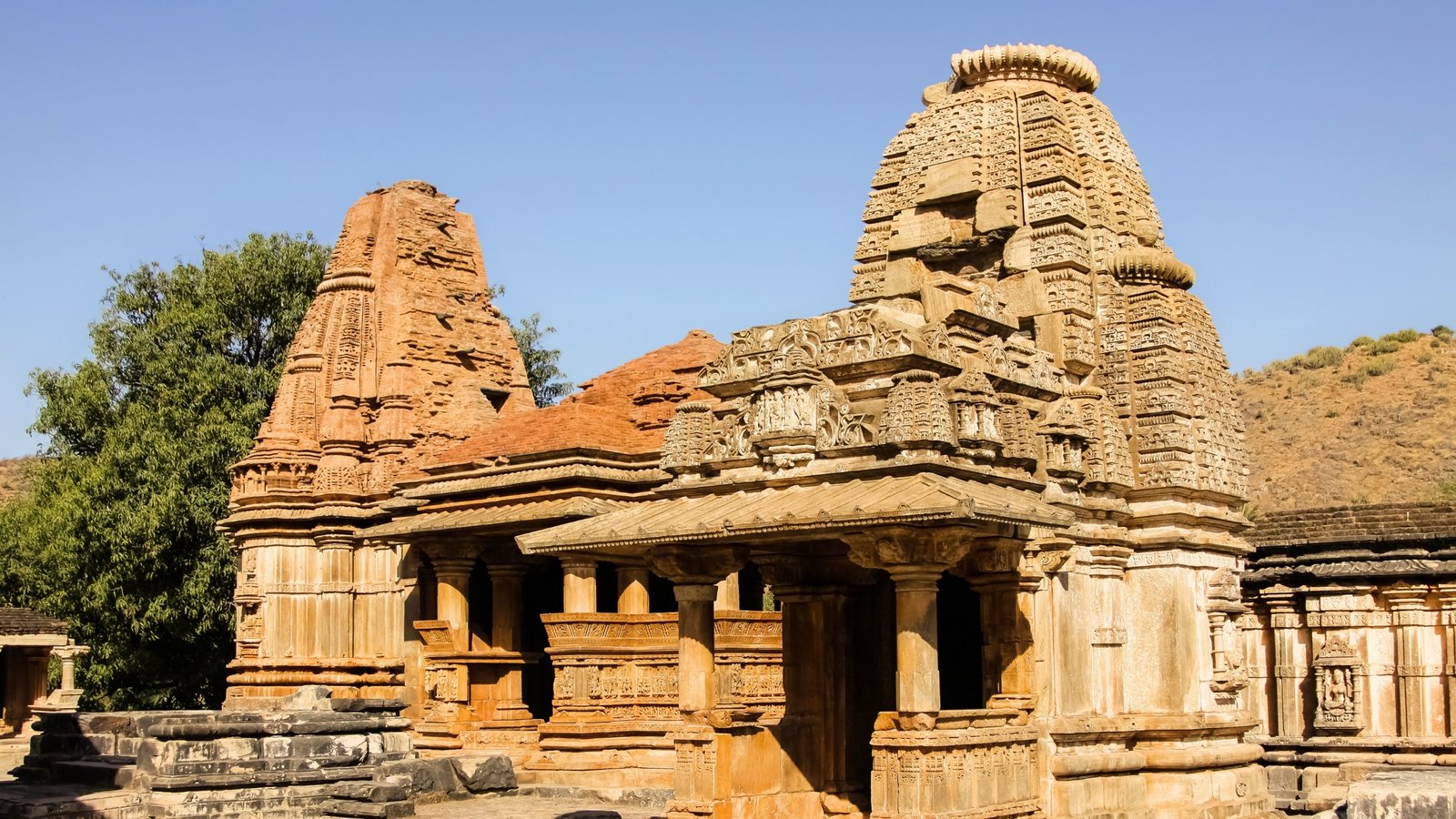 Hilltop view of Sajjangarh Fort in Udaipur, bathed in golden light and overlooking the Aravalli ranges