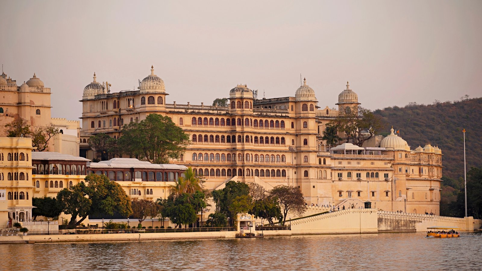 Bagore Ki Haveli in Udaipur—an 18th-century waterfront mansion with intricate jharokhas, mirror work, and courtyards, reflecting Mewar’s aristocratic elegance and cultural heritage.”